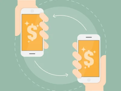 Two hands holding smartphones that send money to each other
