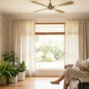 Woman reading on a sofa in a bright, calm living room
